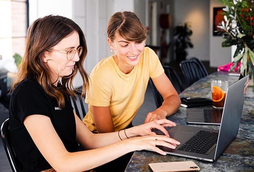 Built for professionals Two female professionals collaborating at a computer